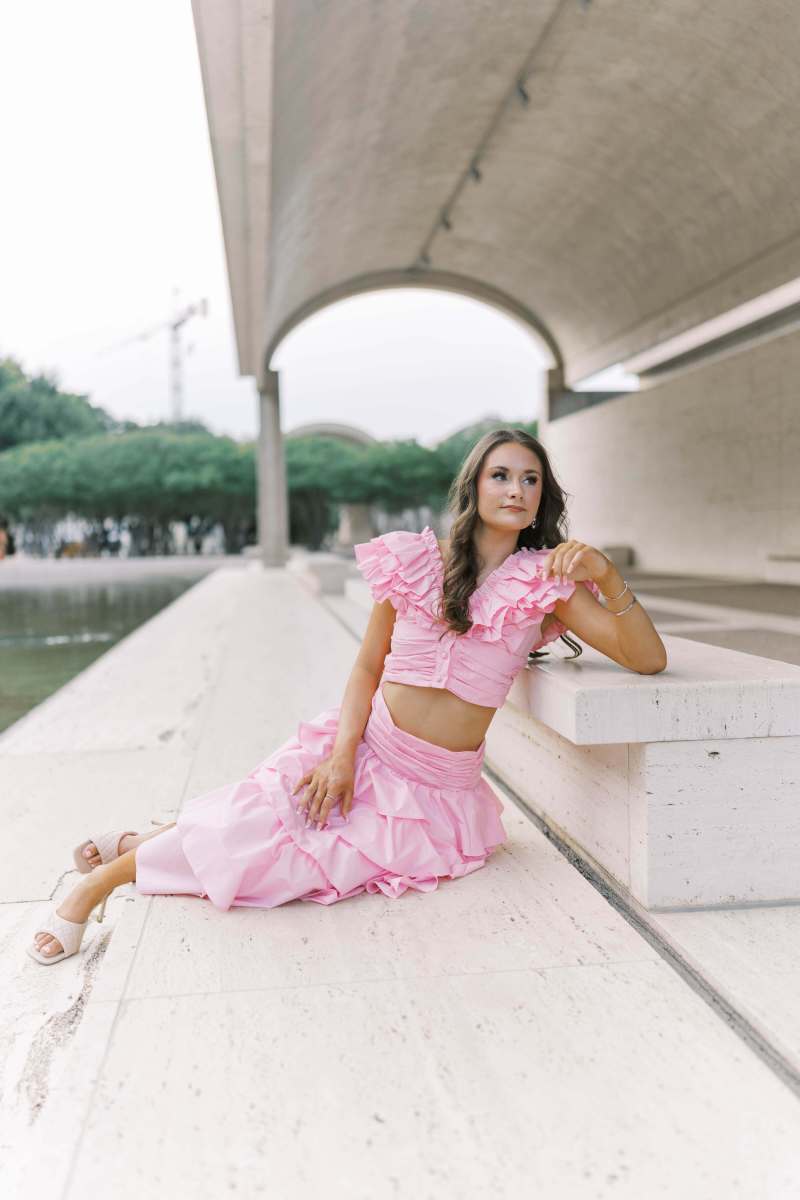 Fort Worth senior session at the Kimbell Art Museum featuring a high school senior posing confidently in front of the museum’s modern architecture and natural light-filled setting